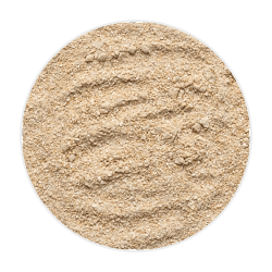 Finely ground oatmeal in a soft, powdery pile with a light beige colour, ideal for dog health and grooming uses
