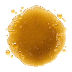 Golden, slightly oily lamb bone broth with a smooth, glossy texture splashed on a clean white background
