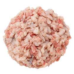 Finely minced redfish in pink, white and pale grey pieces with a moist texture, prepared for dog food recipes