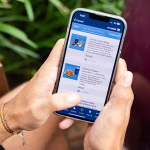 a photo of a hand ordering via the yiros shop app