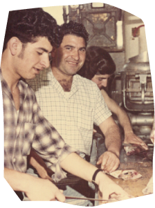 an old photo of three people preparing food