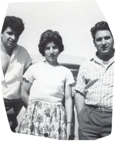 an old photo of two men and a woman