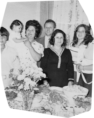 an old photo of people in a family gathering