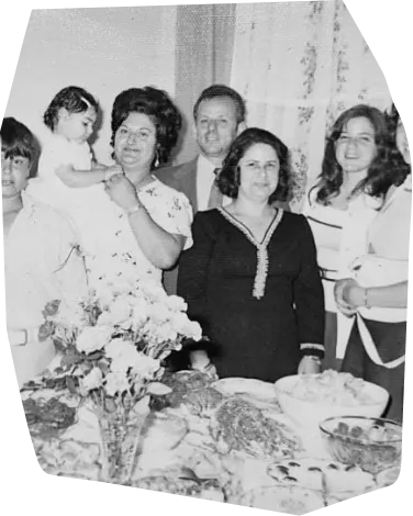 an old photo of people in a family gathering