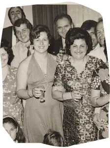 an old photo of two women in a family gathering