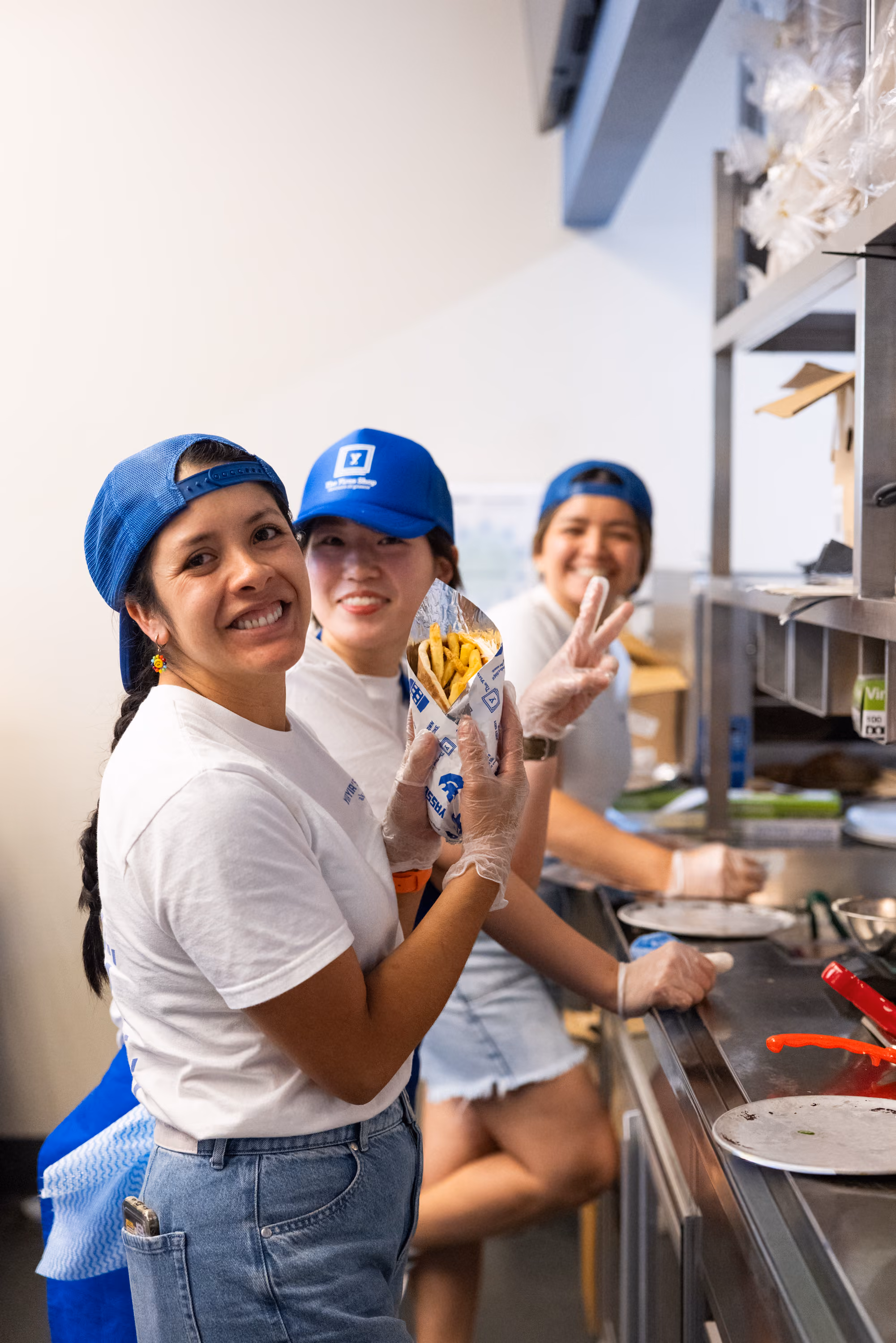 The Yiros Shop crew members smiling on the line