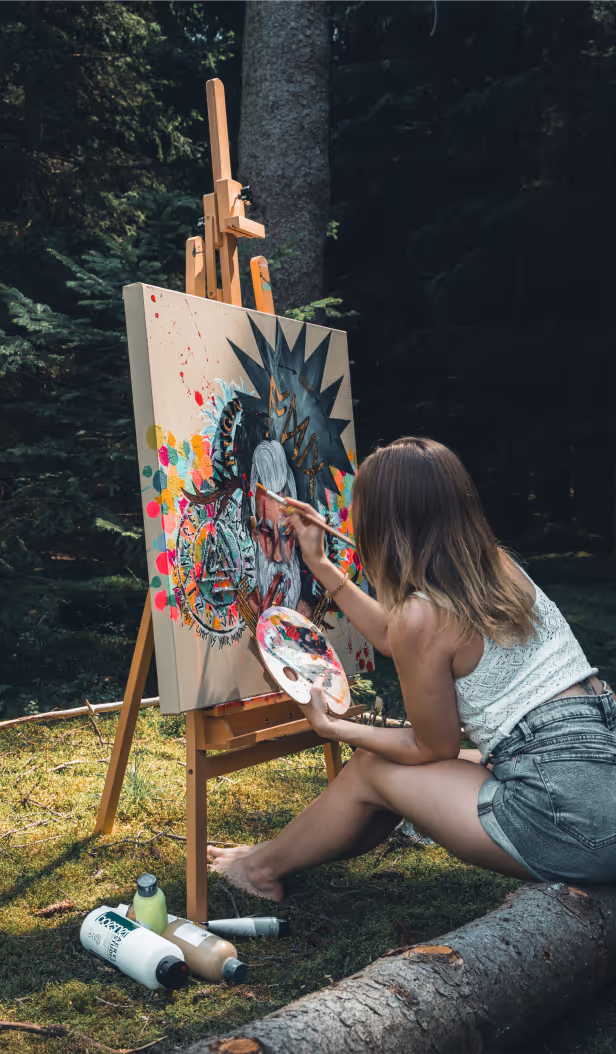 Instructor making a beautiful painting in a nature