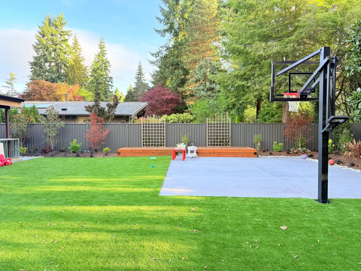 Bellevue backyard with durable ColorMax steel fencing and newly landscaped planting areas