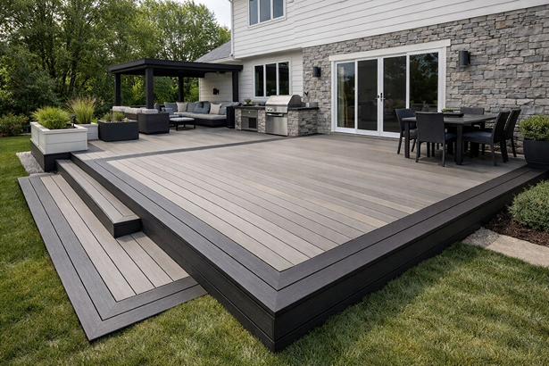 Custom composite deck design featuring multi-level platforms, wide deck boards, and clean modern finishes in a residential backyard