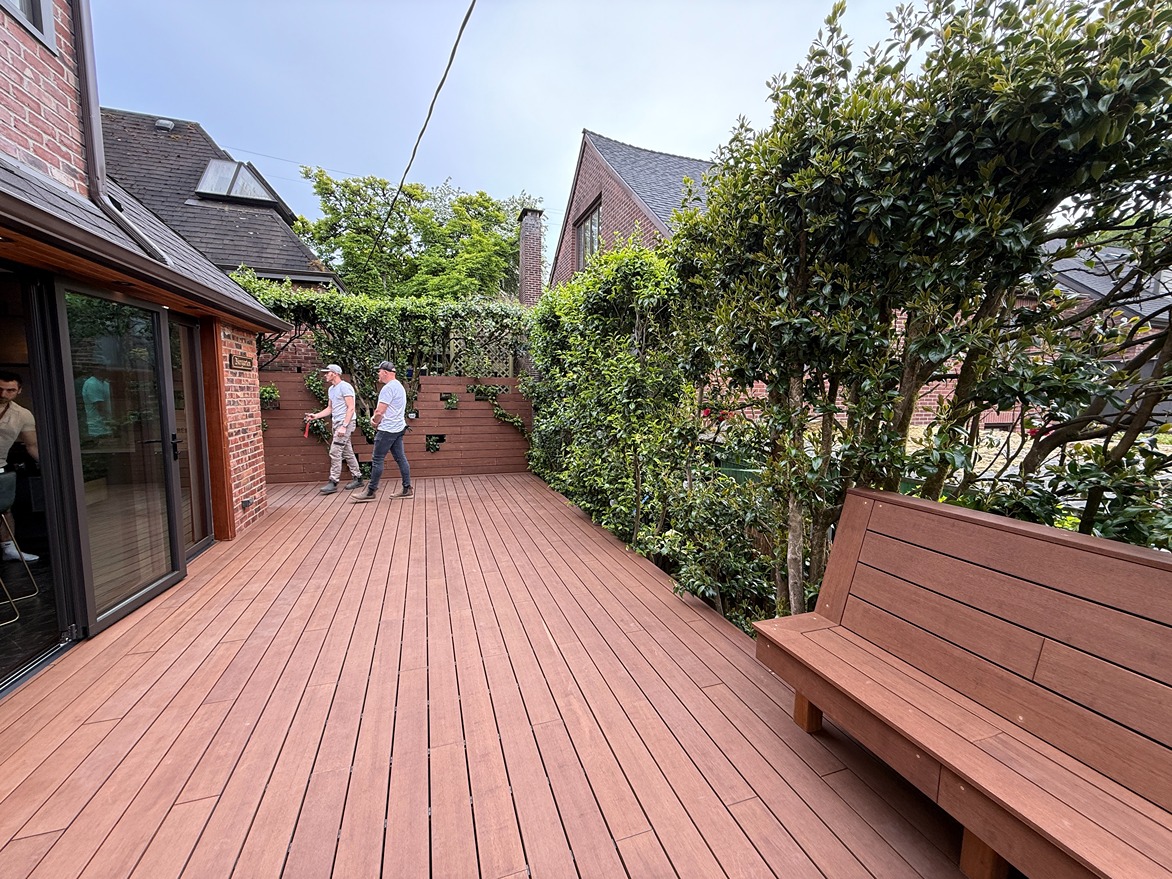 Solid color deck stain finish providing full UV cover on weathered lumber in Bellevue