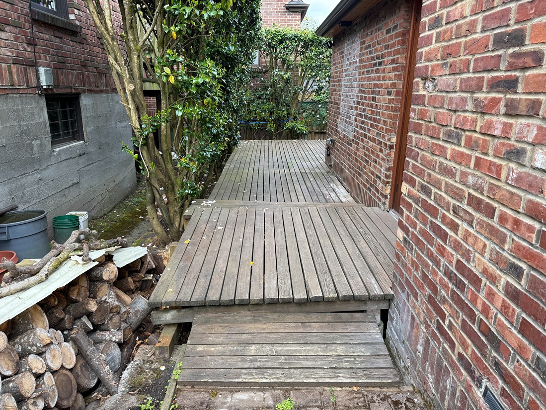 A badly damaged wooden deck due to rains and winter weather in Bellevue