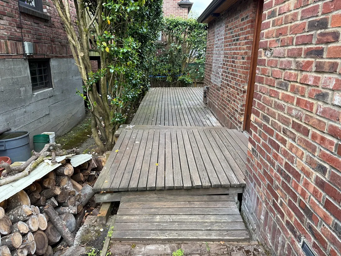 A badly damaged wooden deck due to rains and winter weather in Bellevue