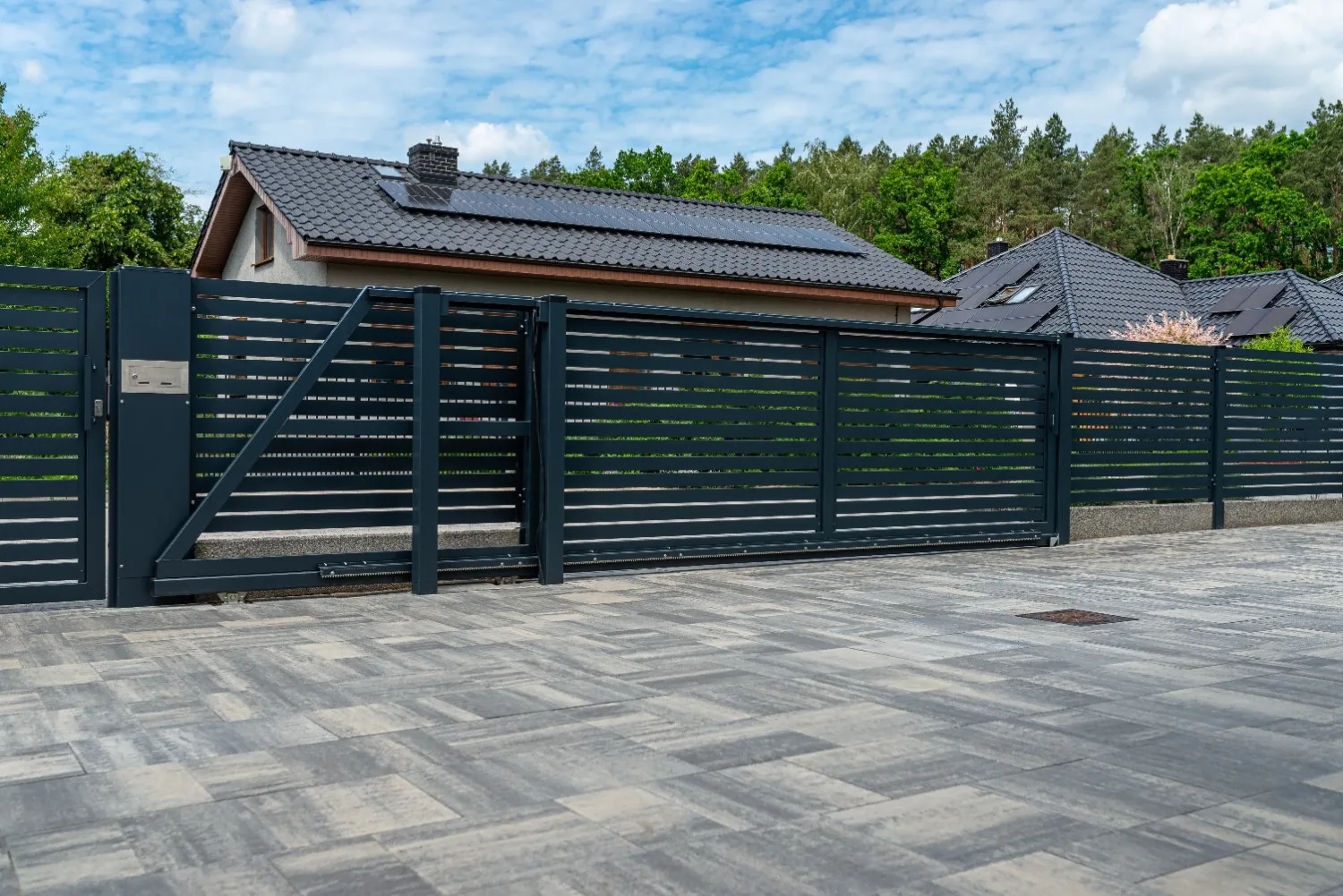 Close-up view of a modern dark gray horizontal vinyl fence showcasing detailed panel construction and contemporary linear profile