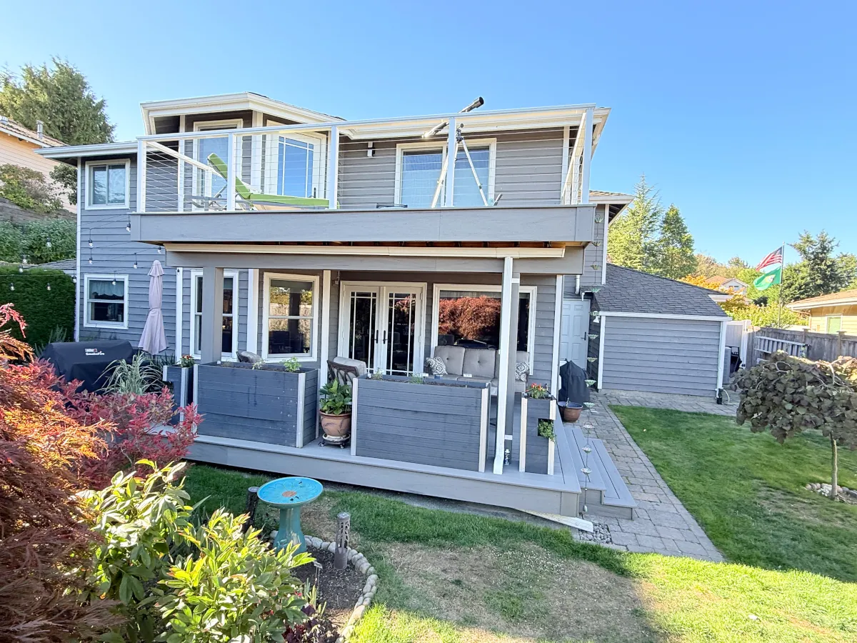 Full home view displaying a professionally built two-story deck enhancing outdoor living space in Tacoma.