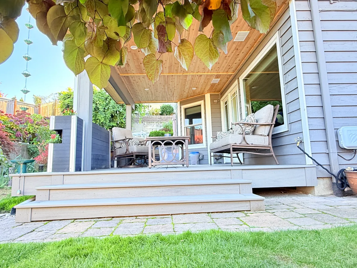 Protected patio below the deck structure.