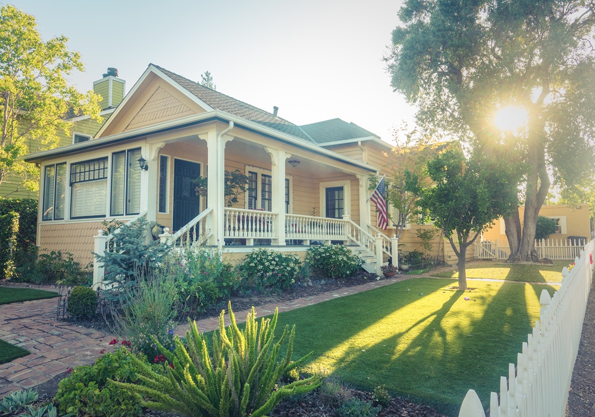 A beautifully maintained Outdoor yard with a wood fence and lush lawn
