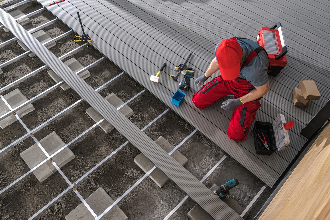 A contractor working during deck construction in a Bellevue home