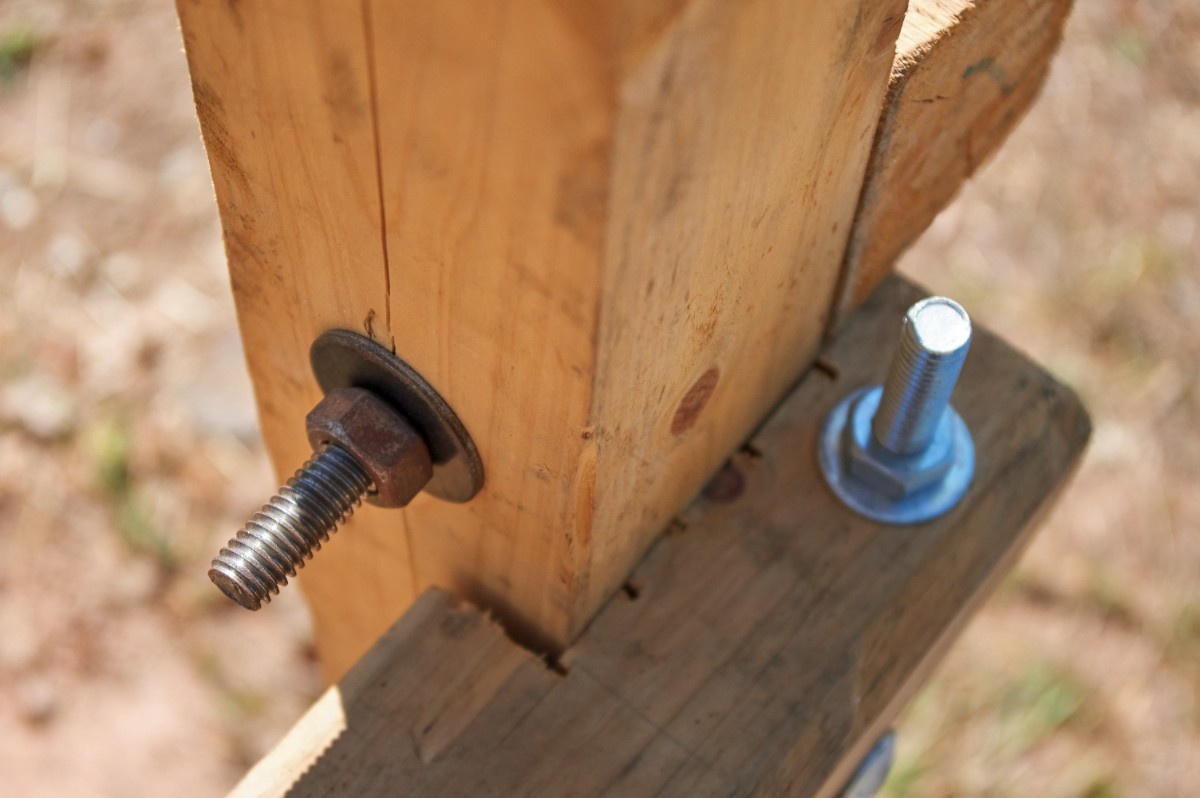 Cedar post on pipe vs wood post base detail at ground level
