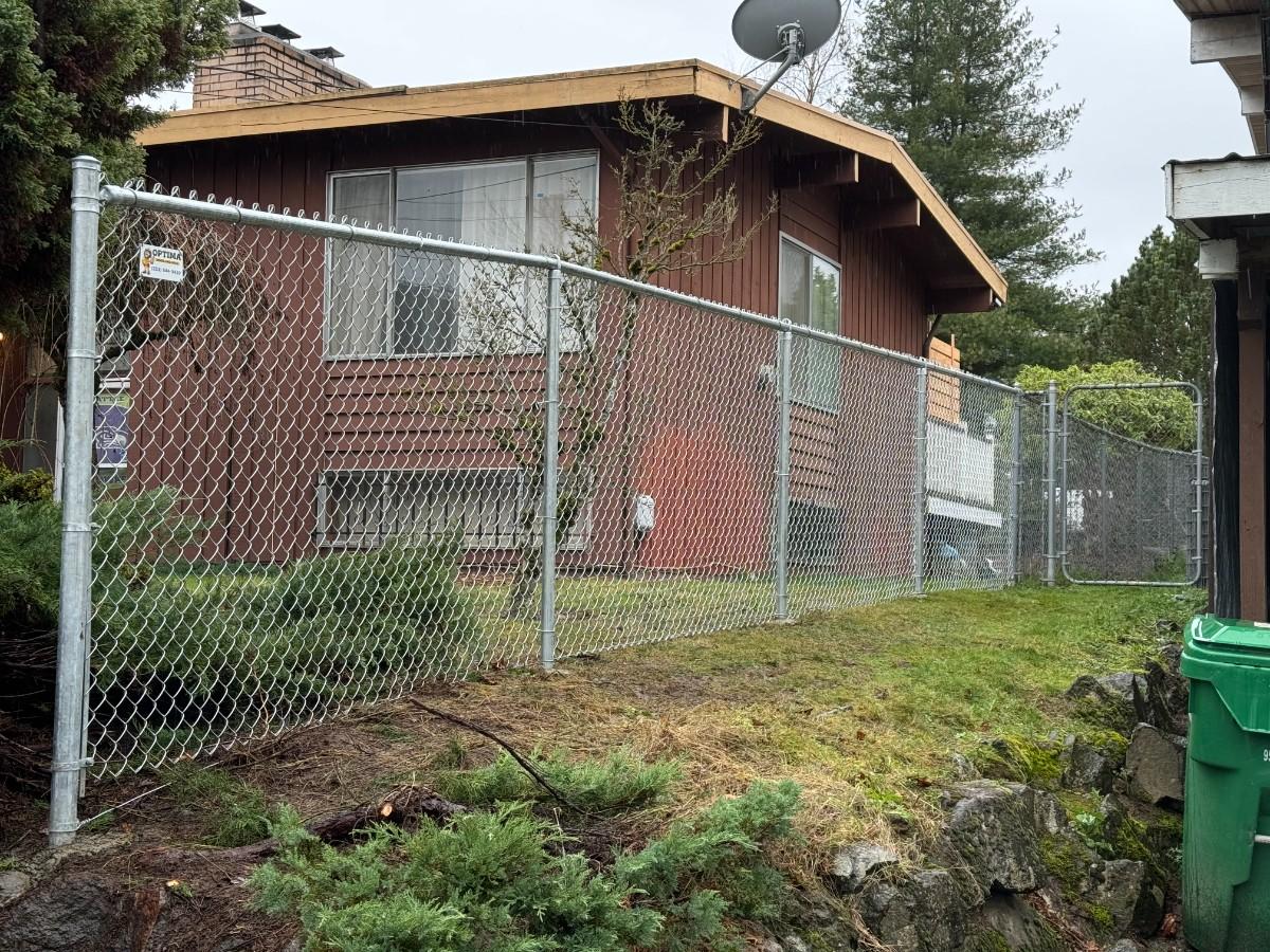 Chain link fence installed in a property built in a sloped area in Bellevue