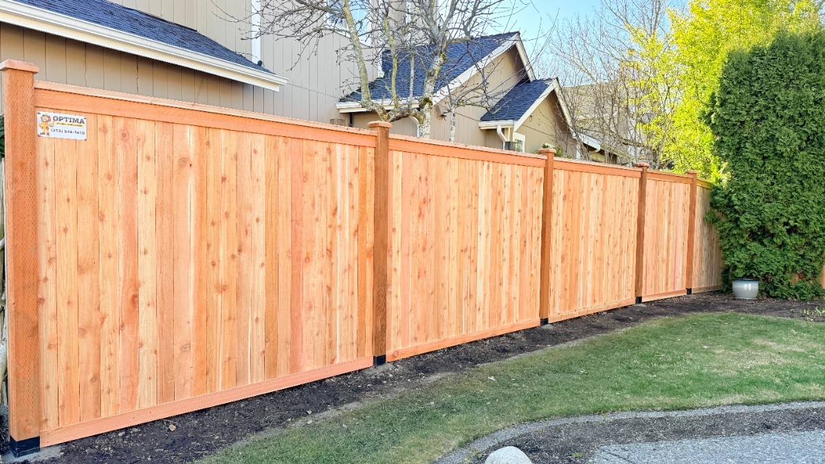 Newly installed wooden fence securing a luxury home in Bellevue
