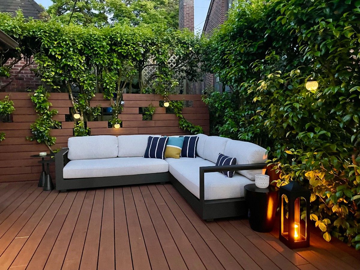 Composite deck outdoor living space in Bellevue furnished with a lounge couch and seating area