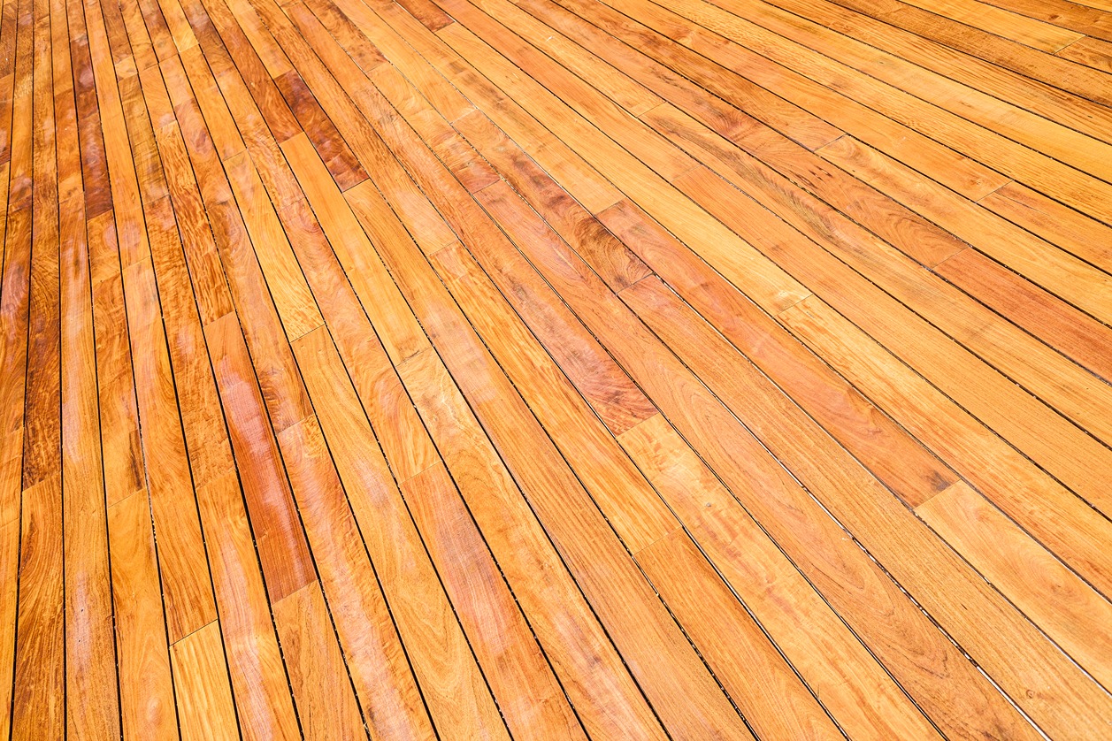 Completed deck staining project with even penetrating oil finish on a Bellevue residential deck