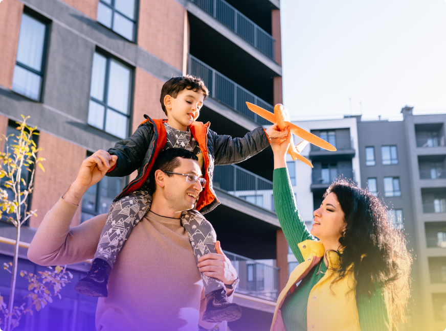 Family outside an apartment building