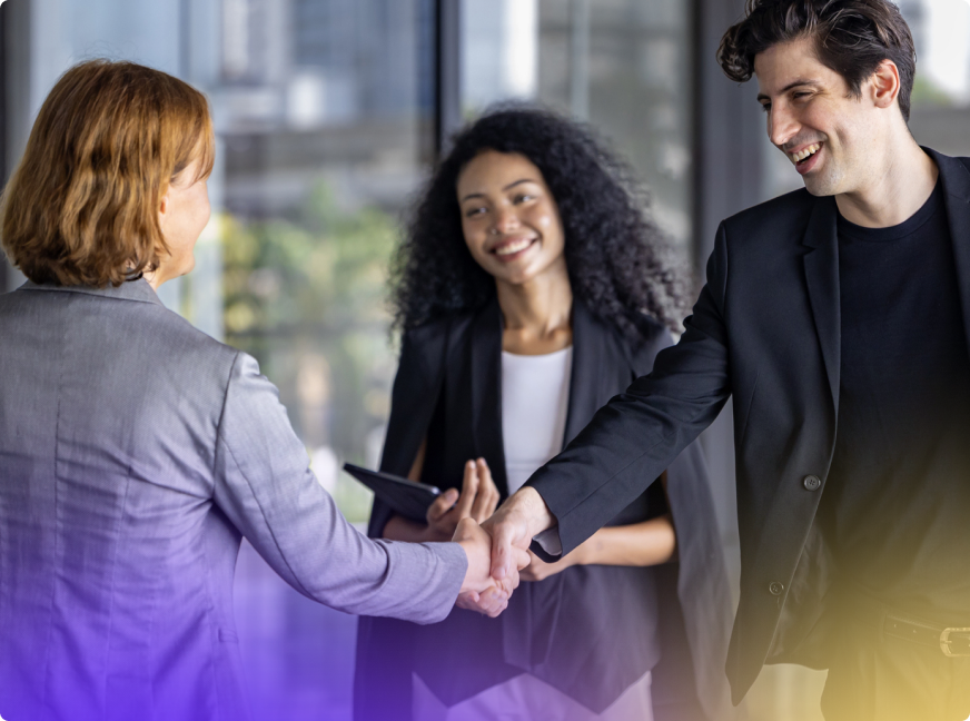 Team shaking hands in an office