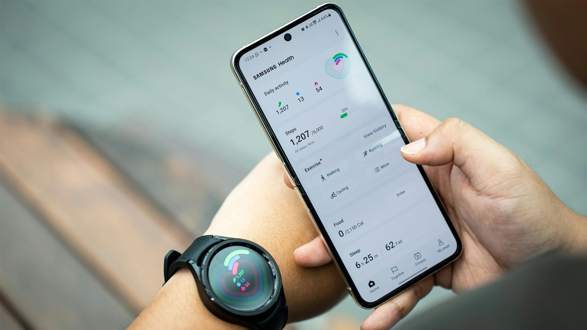 Someone checking their wearable fitness tracker