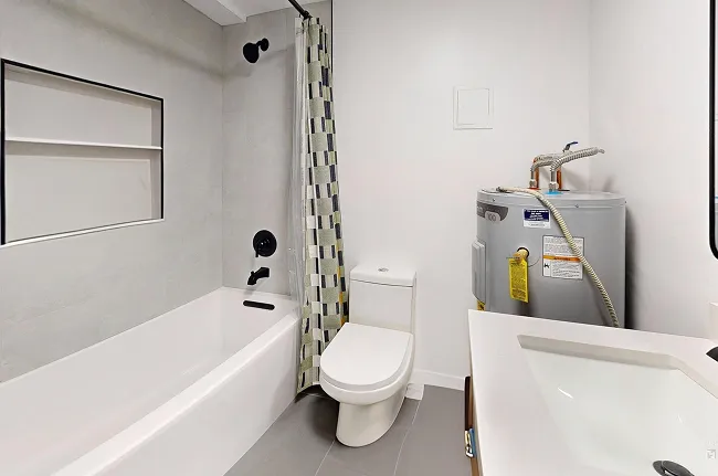 The finished Queen Anne condo bathroom, brighter and more open than before