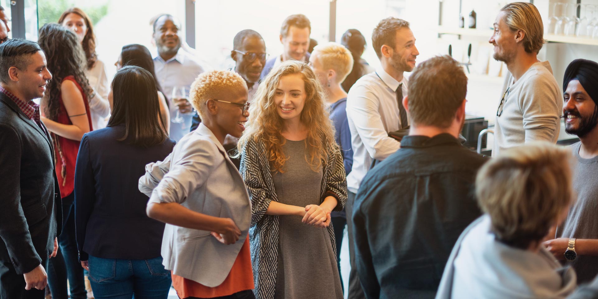 a large group of professionals networking at a corporate event