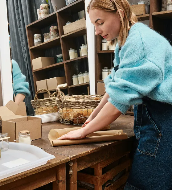 A natural business employee packing orders