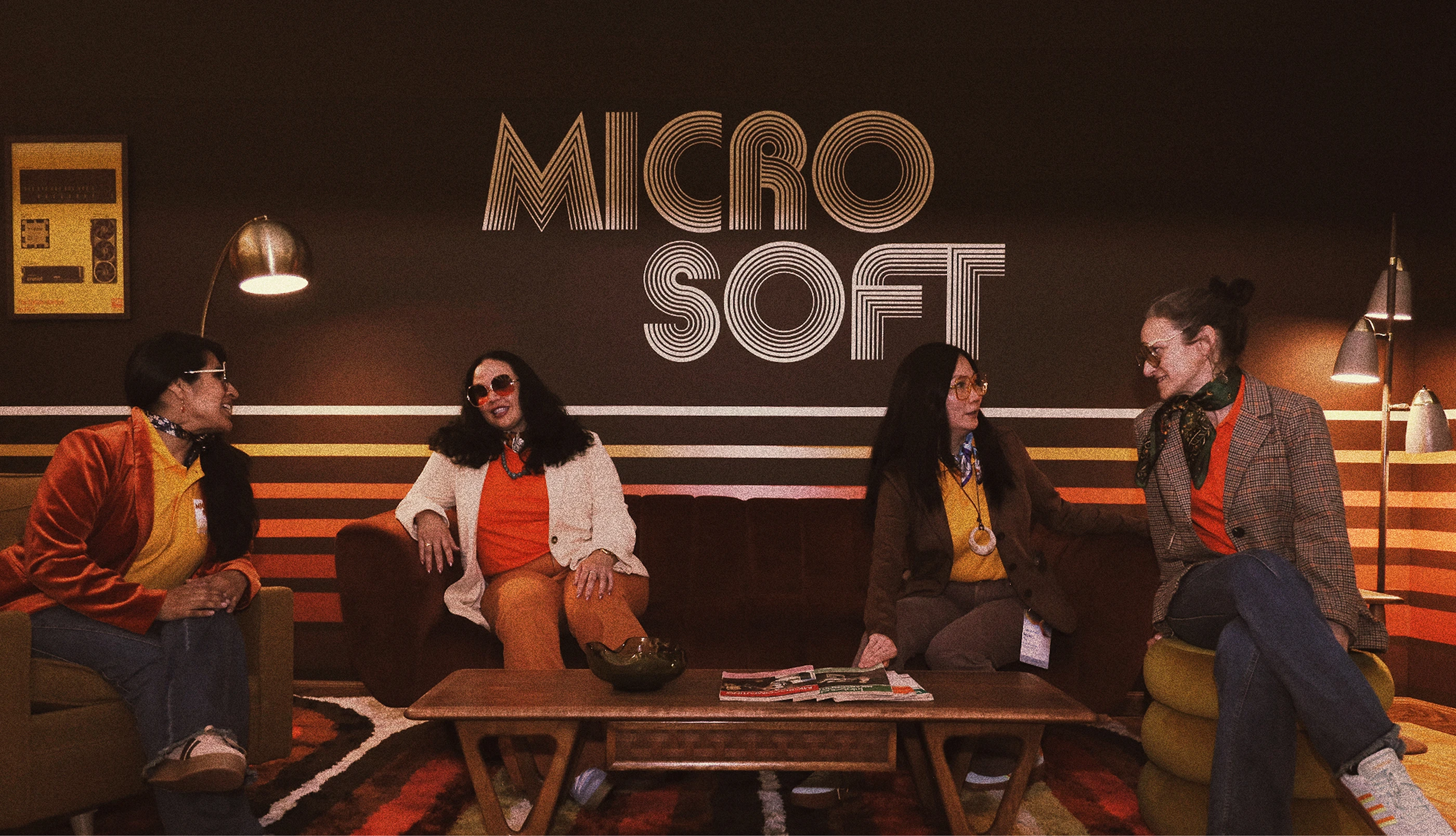 The Original Build’s 1970s-inspired lounge with a vintage MICRO SOFT wall graphic