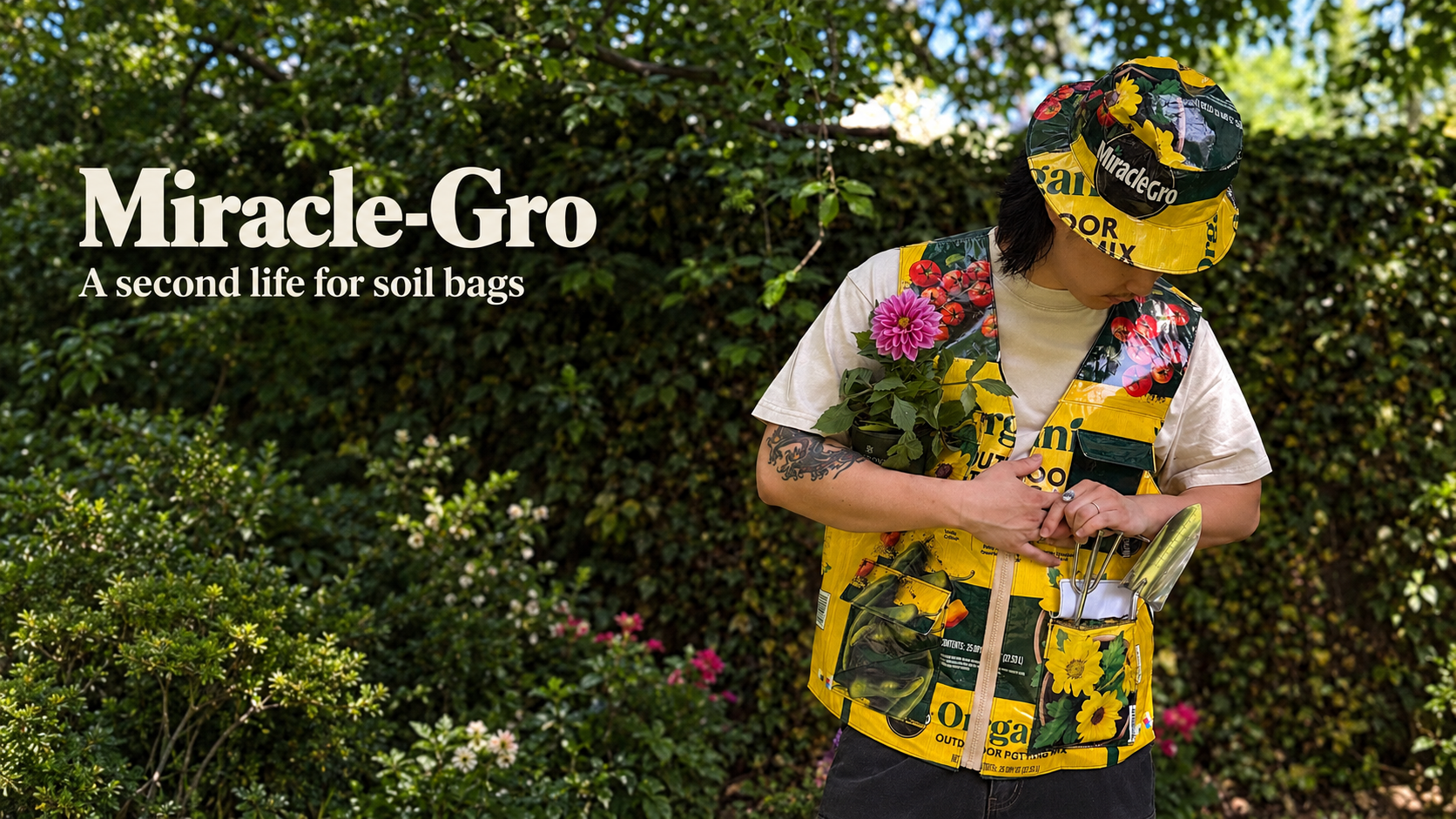 Miracle-Gro vest and bucket hat made from soil packaging, photographed in a garden