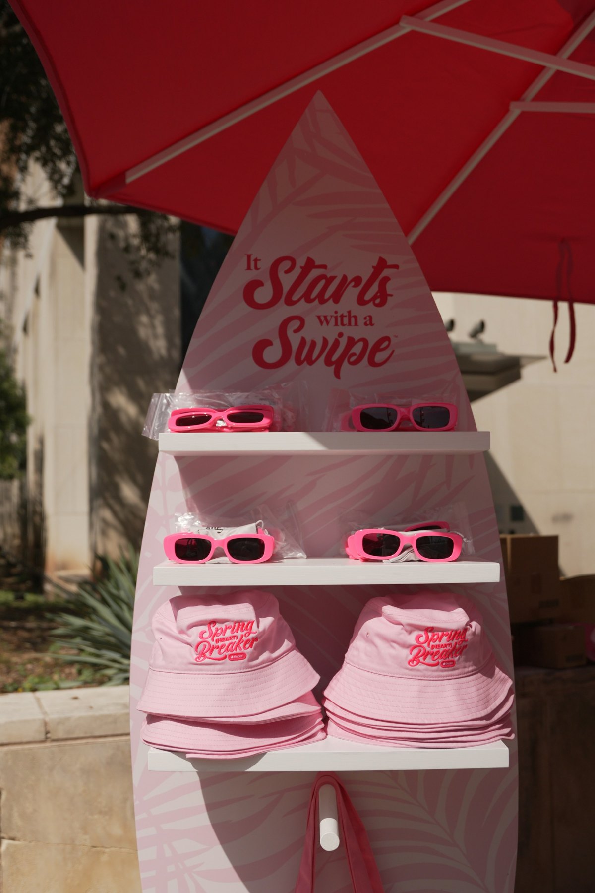 Pink Spring Heart Breaker bucket hats arranged at the Tinder activation