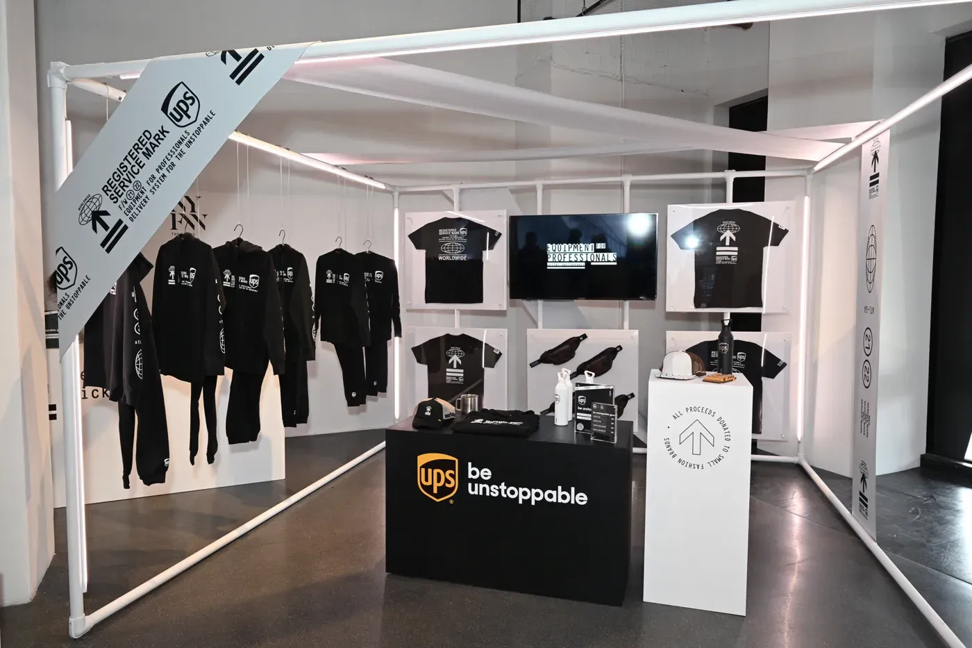 UPS Be Unstoppable pop-up at Spring Studios during New York Fashion Week, with graphic tees and hoodies on display