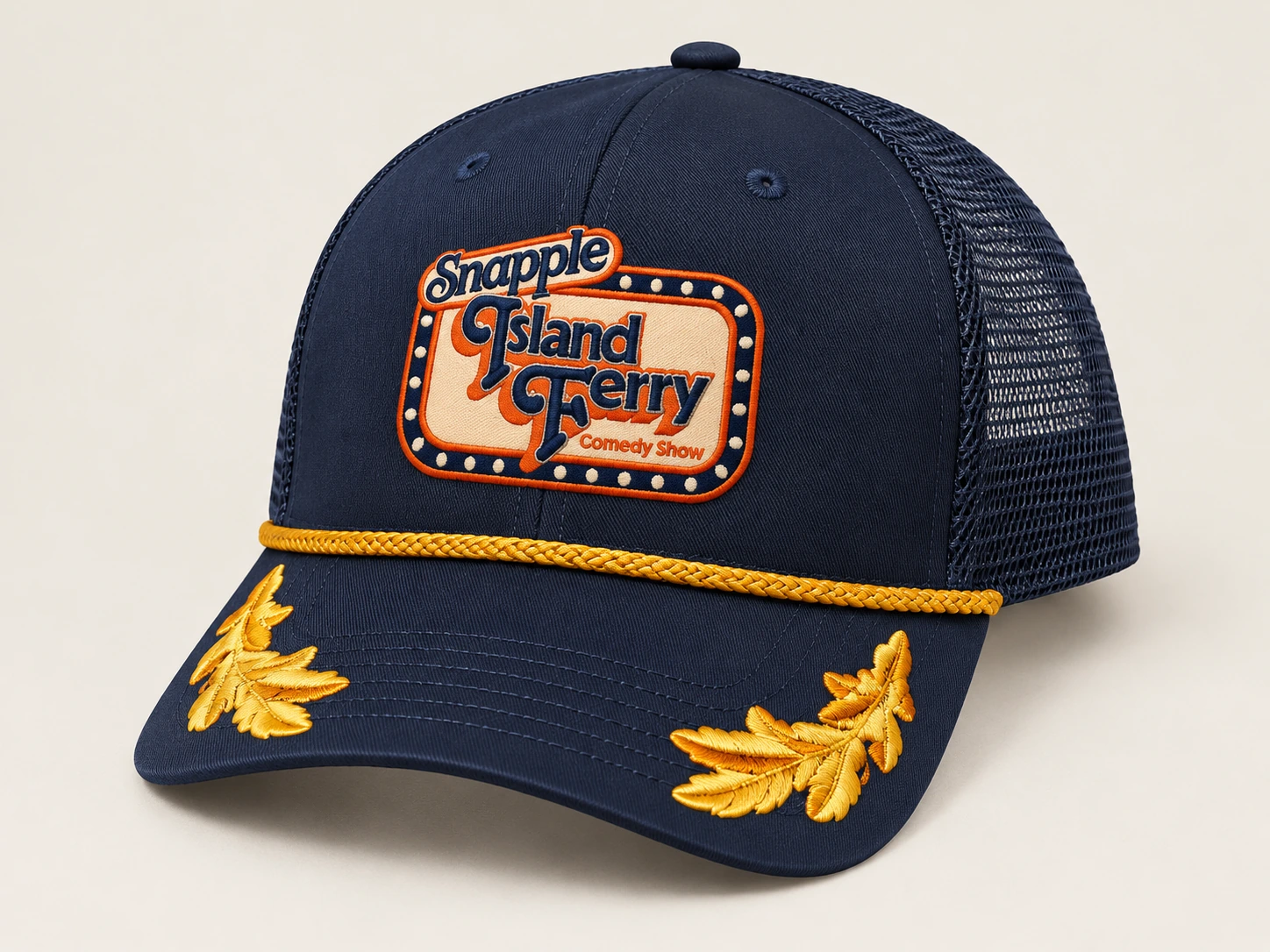 Studio photograph of the navy event cap with gold rope and embroidery