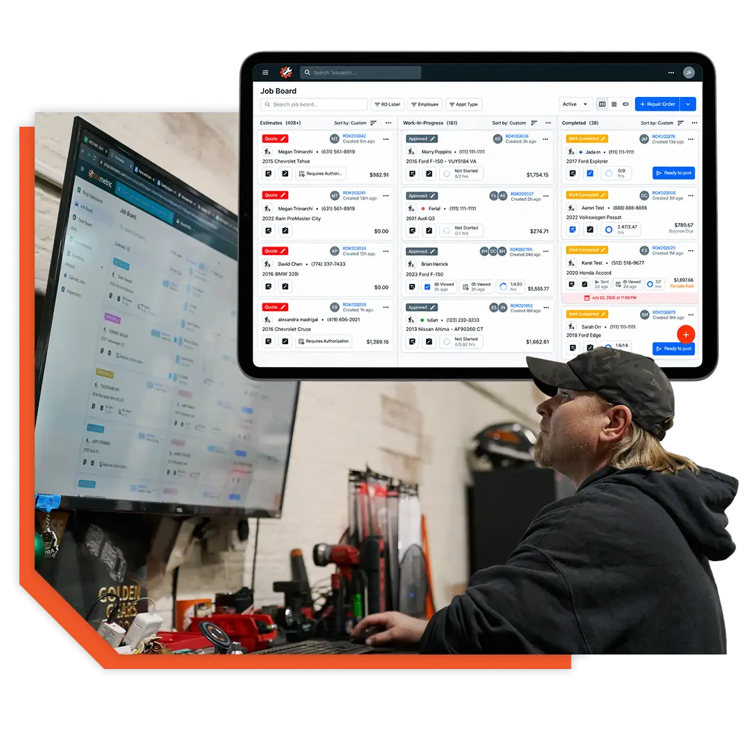 An automotive mechanic using Tekmetric on a computer with his shop as the background.