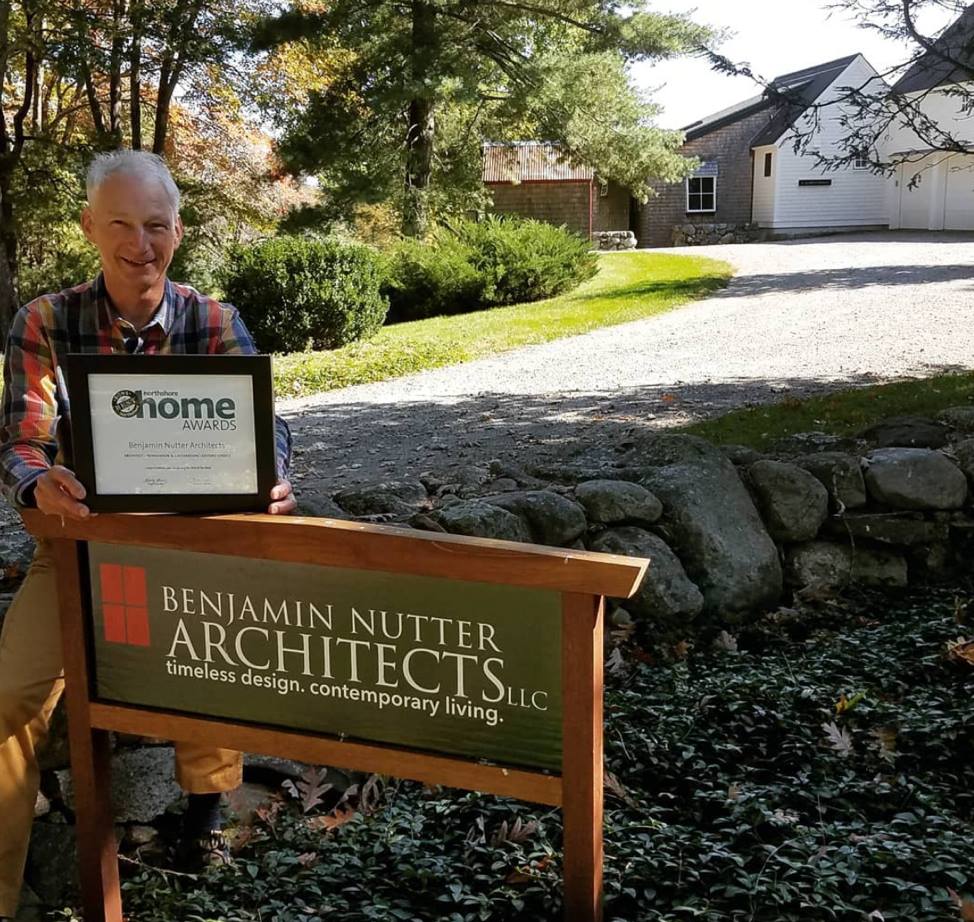 Benjamin Nutter in front of office sign