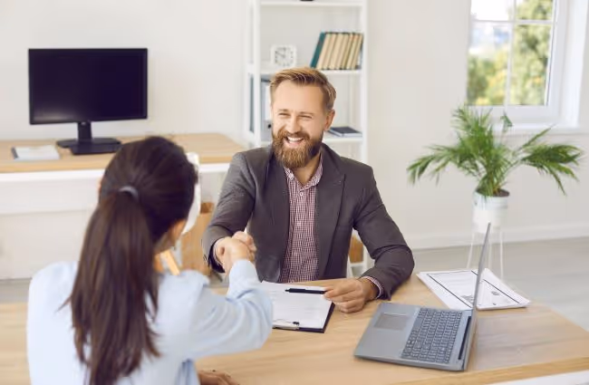 Man and woman shaking hands, Encompass End-User training