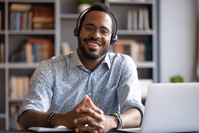 Man with folded hands wearing a headset, Encompass go live support training