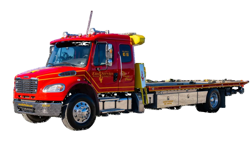 Elite Flatbed Tow Truck Hauling Red Pickup