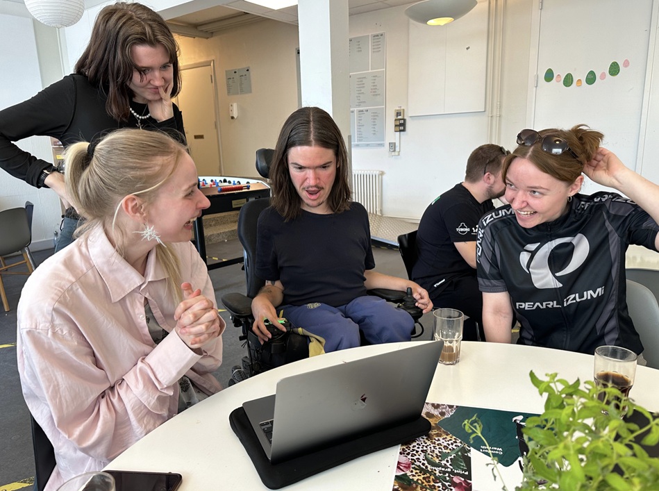 Students from Kolding Design School and a representative from the Association of Young People with Disabilities work together.