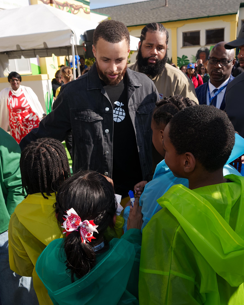 Steph Curry and a community event greeting kids