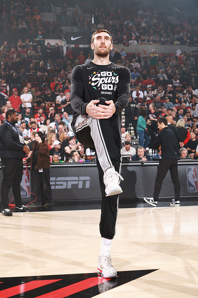 Luke Kornet #7 of the San Antonio Spurs warms up