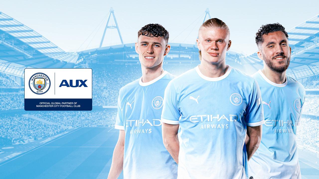 AUX and Manchester City representatives at the global partnership signing ceremony