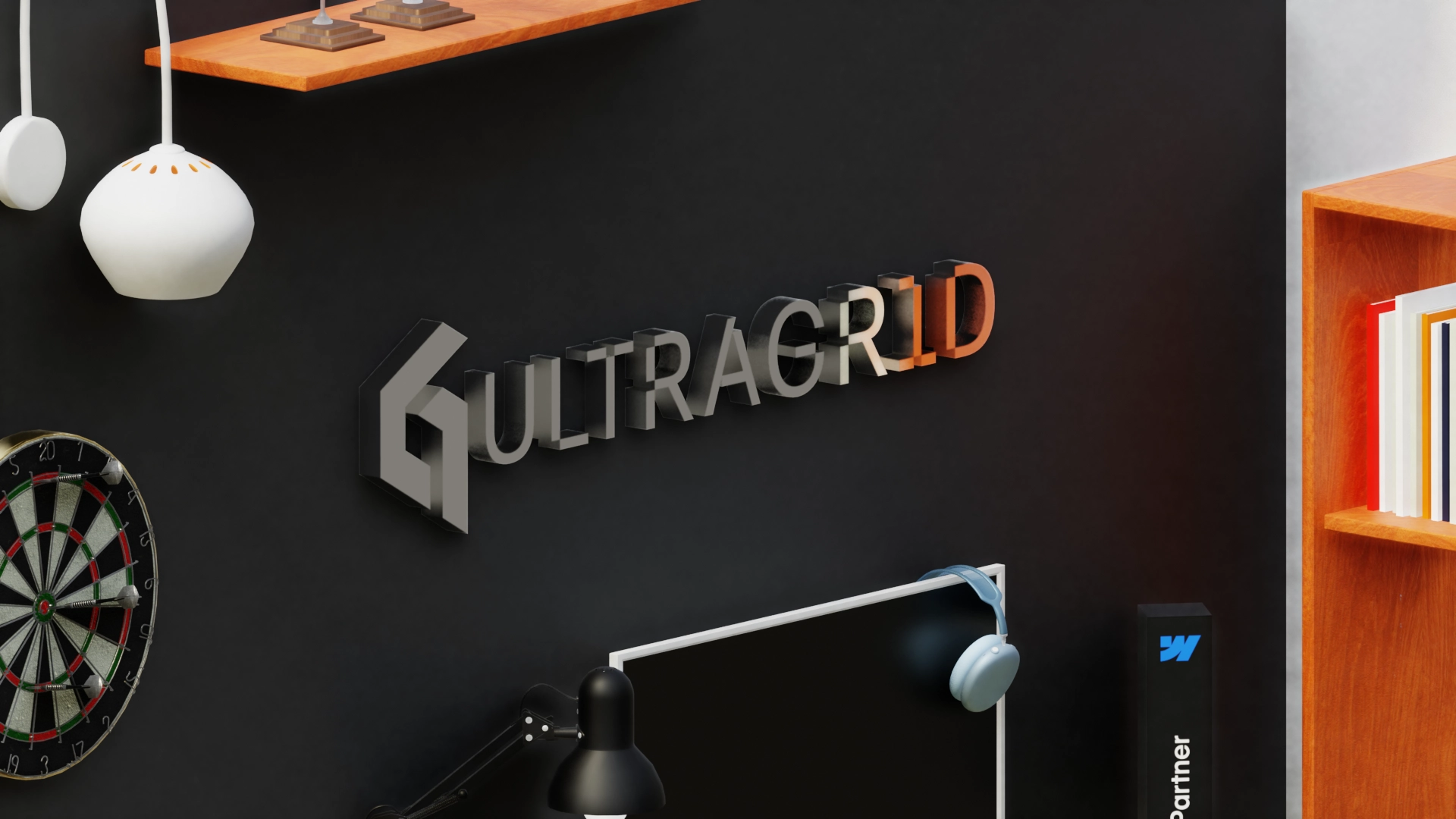 Office wall with Ultragrid logo, dartboard, hanging lights, and a computer monitor with headphones.