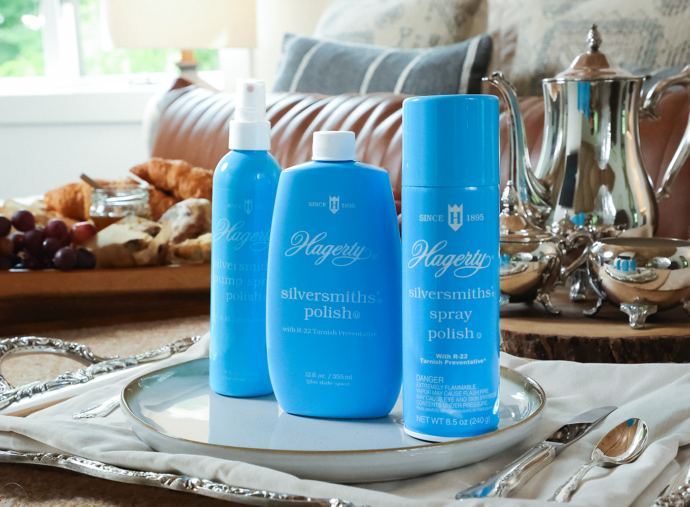 Hagerty Silver Clean products in front of beautiful, cleaned silver