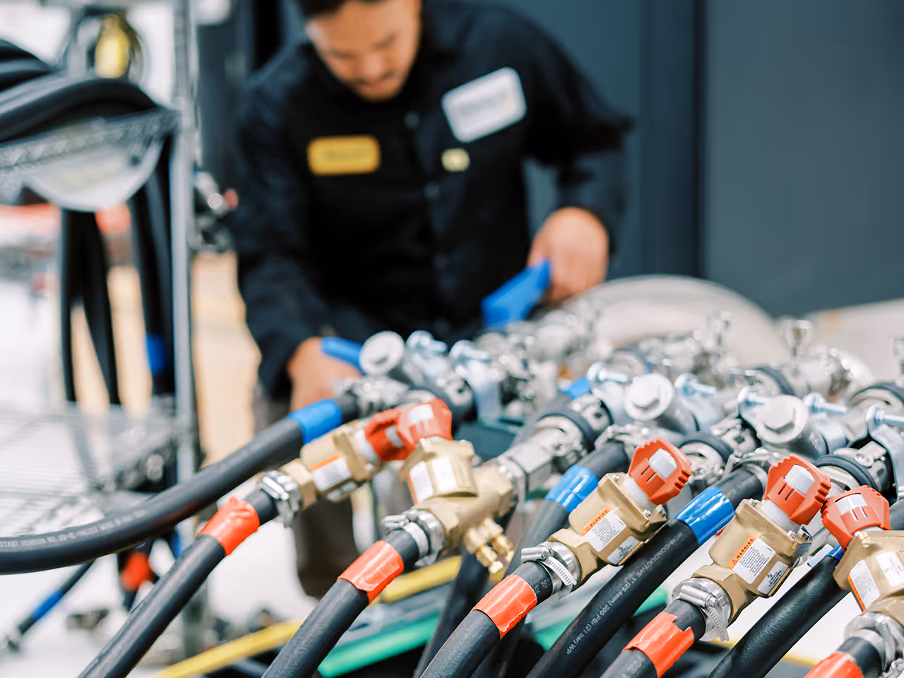 Man connecting servers to cooling equipment