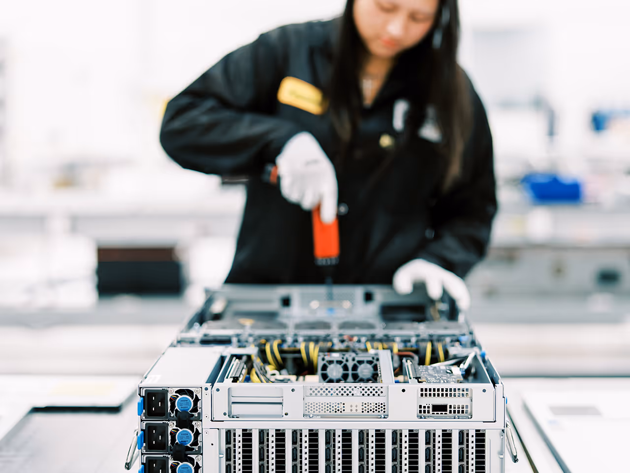 Woman working on server assembly